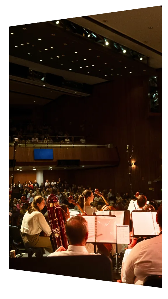 Orchestra on stage with full audience