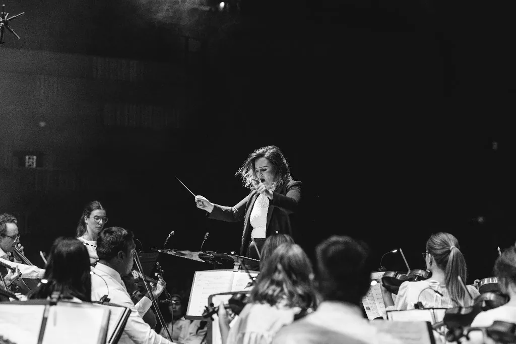 Natalia conducting with passion