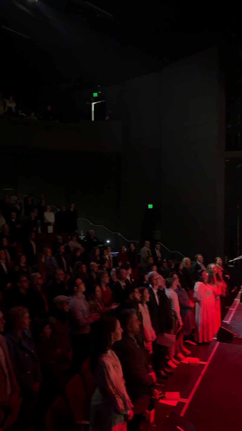 An engaged audience is captivated by a performance.