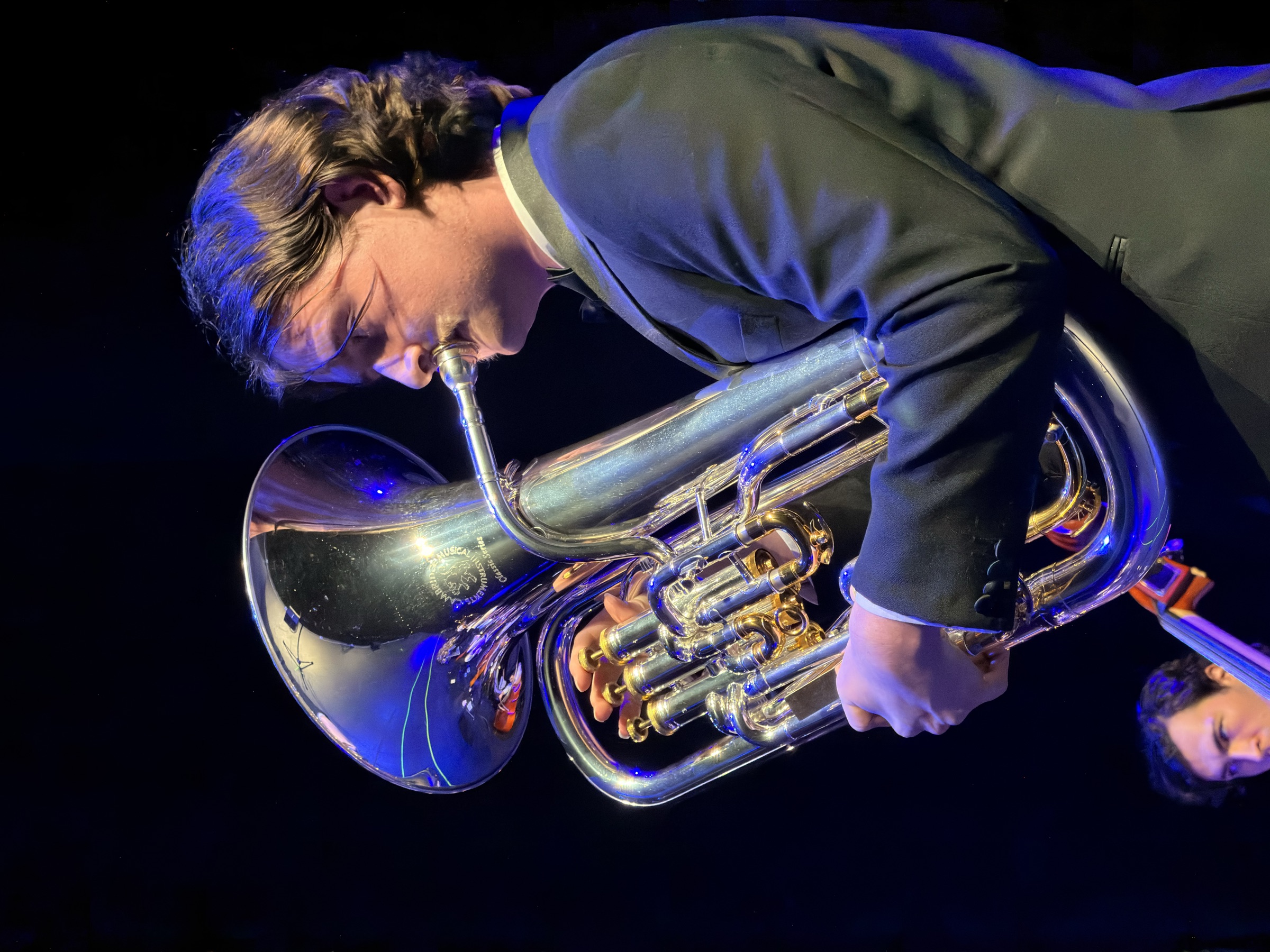 A close-up of the euphonium soloist mid-performance at the Australian Christian Proms.
