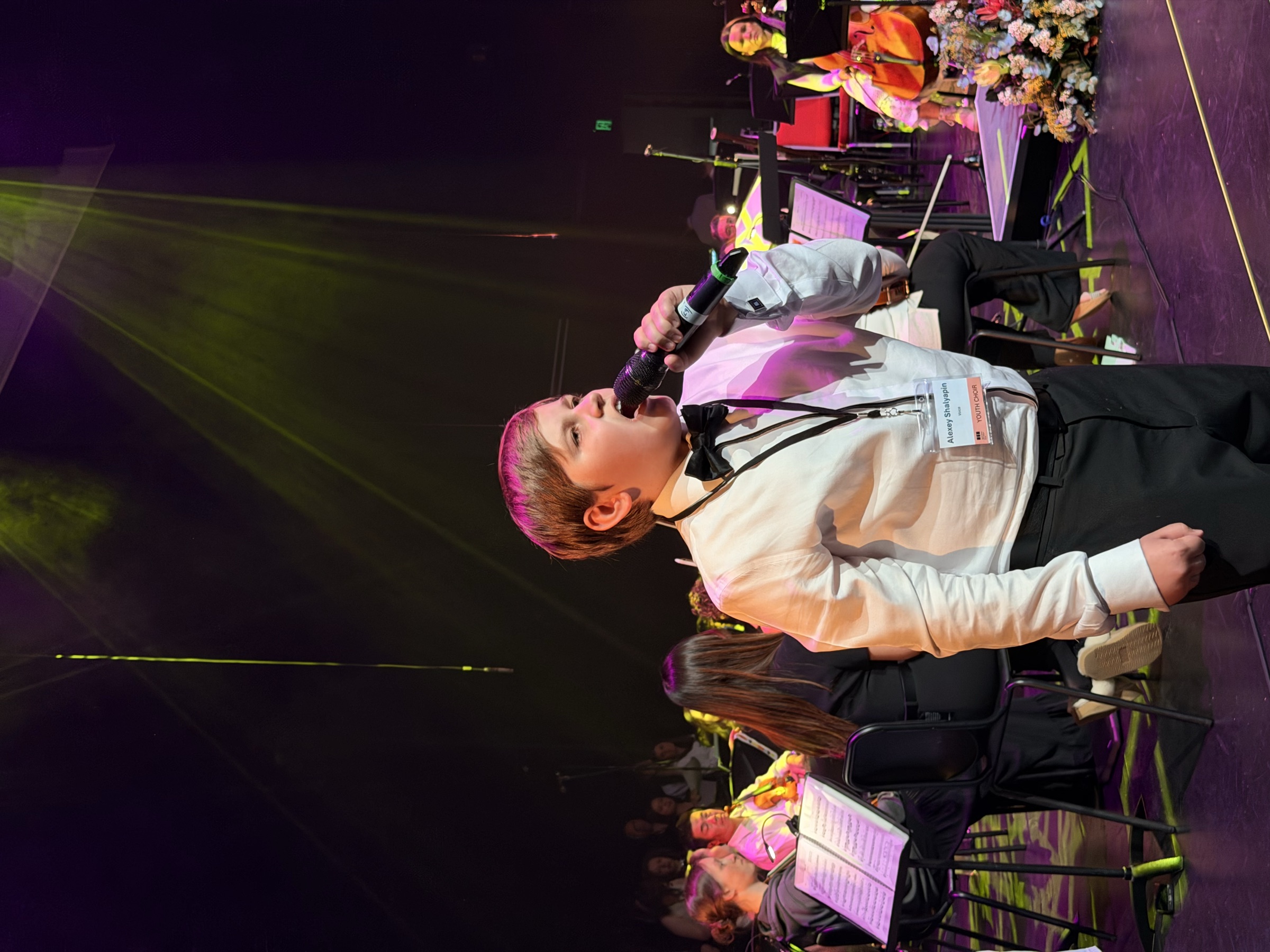 A young vocal soloist performing with the orchestra at the Australian Christian Proms, Sydney.